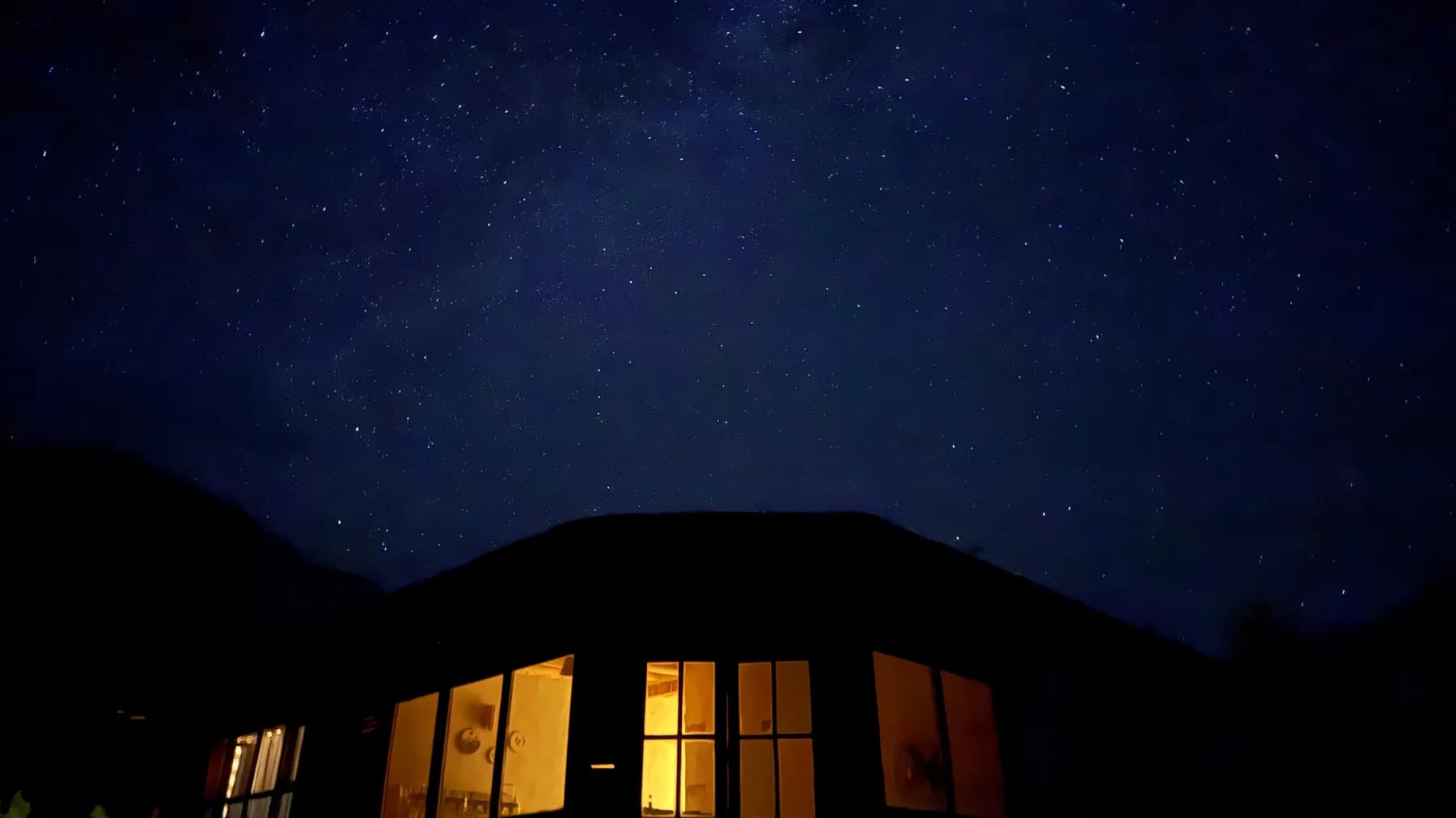 The lodge silhouette against the night sky
