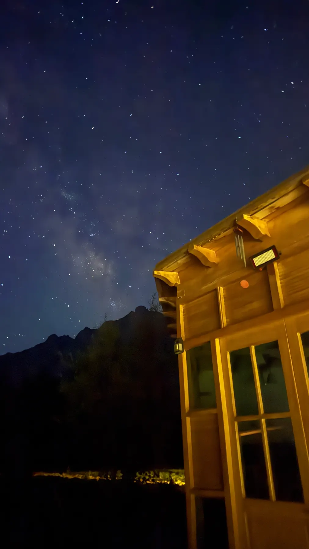 The lodge porch under a star-filled sky